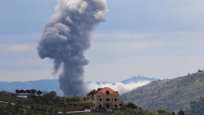 Smoke rises from Taibeh, following Israeli strikes in response to cross-border rocket fire, as seen from Marjayoun in southern Lebanon, March 22, 2025. REUTERS