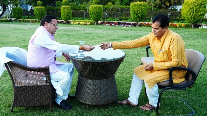 Uttarakhand Parliamentary Affairs and Finance Minister Premchand Aggarwal submits his resignation from the cabinet to state Chief Minister Pushkar Singh Dhami, in Dehradun on Sunday. (ANI Photo)