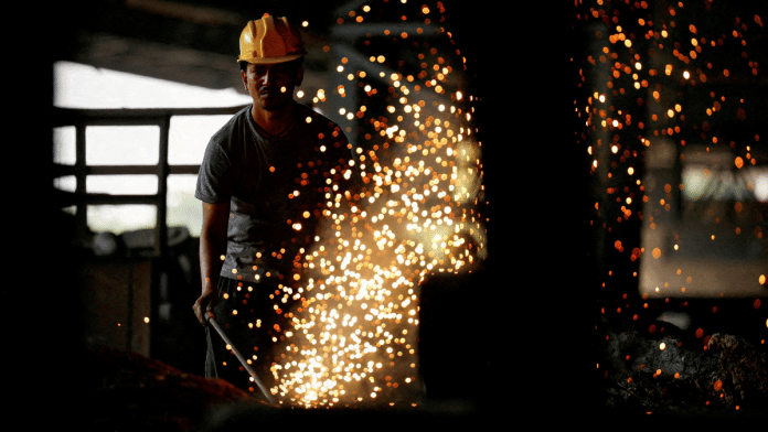 An employee works at a steel processing production line of a factory in Mandi Gobindgarh in the northern state of Punjab, India, October 19, 2024 | Reuters file photo