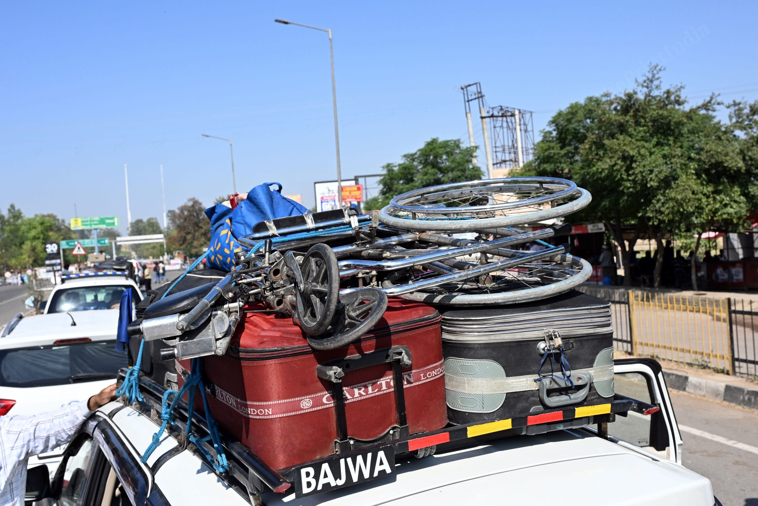 Mohammad Ayan, 17, a Pakistani national wheelchair on the top of the car who came to India to seek treatment for his accidental paralysis | Photo: Suraj Singh Bisht, ThePrint