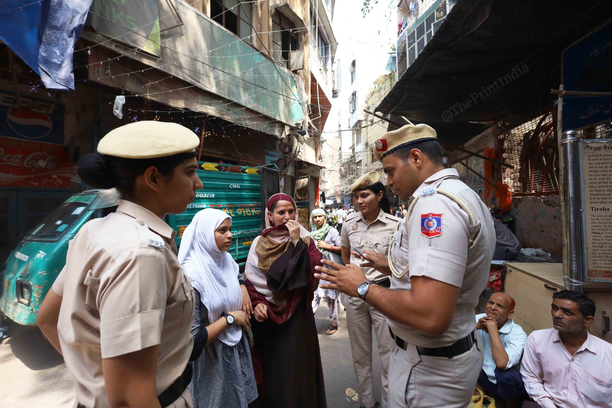 A Shishtachar squad speaks to women on the street. | Manisha Mondal | ThePrint