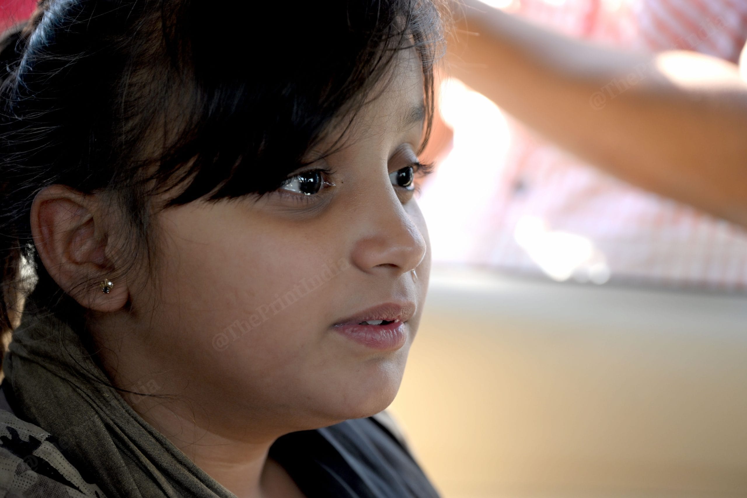 11 years old Zainab breaks down because her mother cannot go to Pakistan with her | Photo: Suraj Singh Bisht, ThePrint