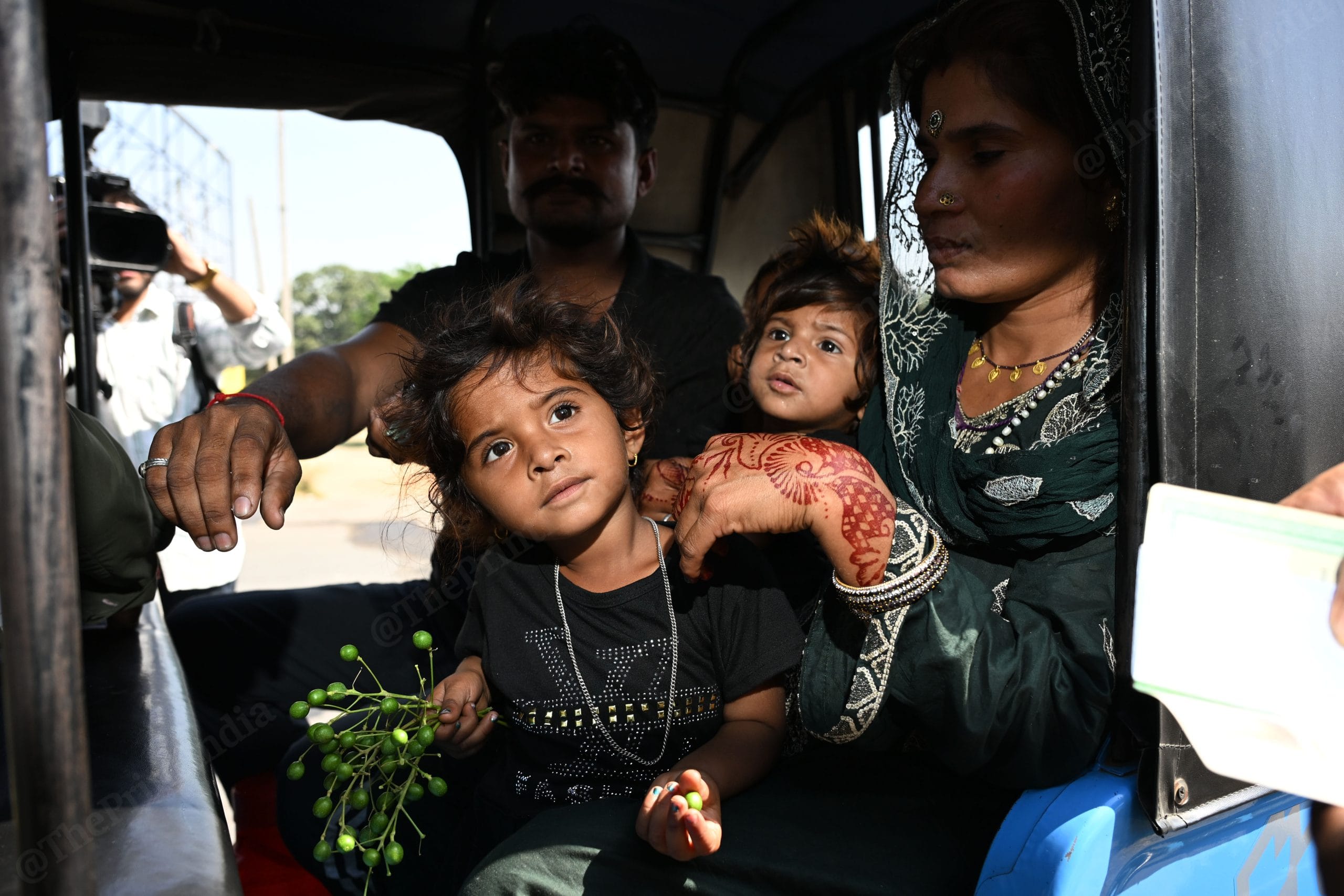Pakistani children looking at BSF personnel while he is checking her passport at Attari-Wagah Border | Photo: Suraj Singh Bisht, ThePrint