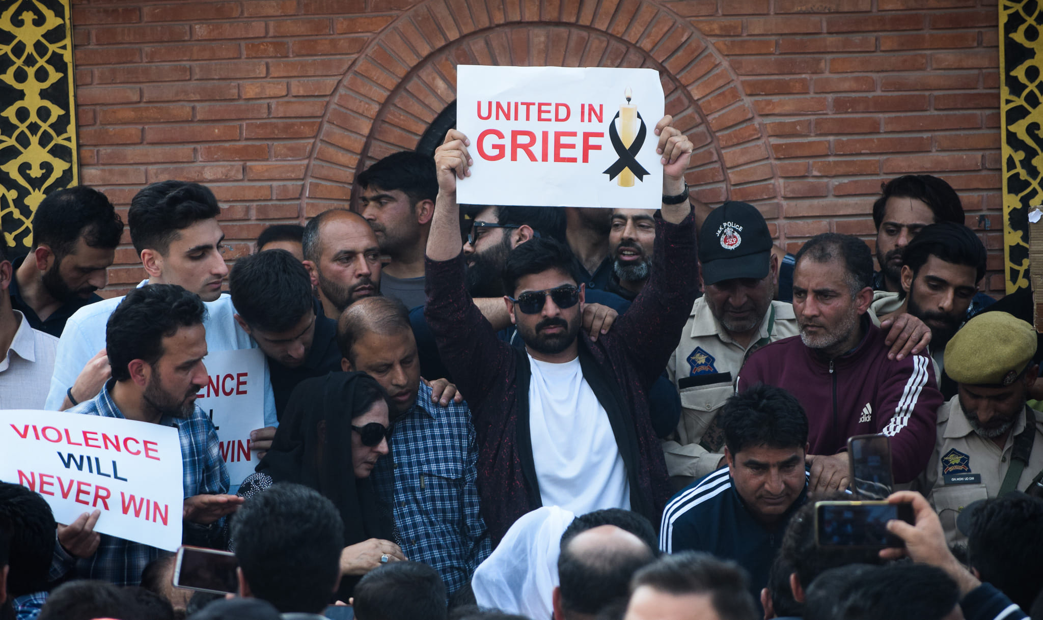 Protesters in Srinagar holding placards which read 'United In Grief' and 'Violence Will Never Win' | Sharanveer Singh | Former intern of ThePrint School of Journalism