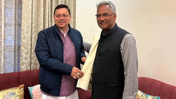 Uttarakhand CM Pushkar Singh Dhami with former state CM Trivendra Singh Rawat. | ANI