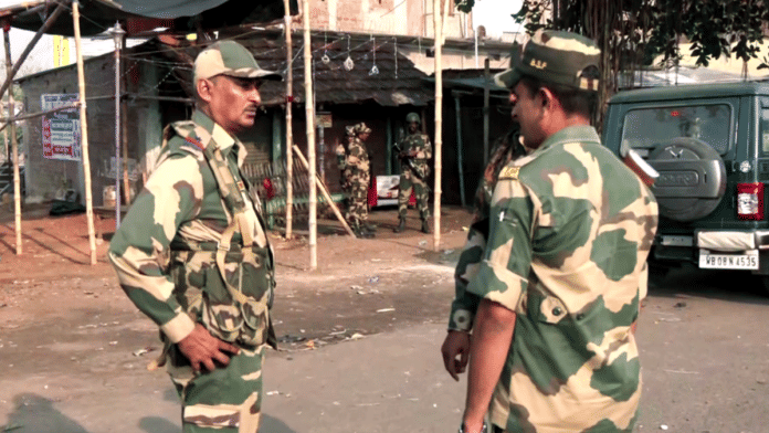 Security personnel stand guard after violent protests against the Waqf (Amendment) Act, at Dhuliyan in Murshidabad on Saturday. Three people killed in the violent protests | ANI