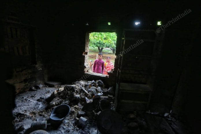 A man looks into a house vandalised during the Murshidabad violence | Praveen Jain | ThePrint