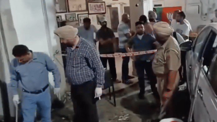 Police team outside the residence of BJP Leader Manoranjan Kalia in Jalandhar. | Screen grab | ANI