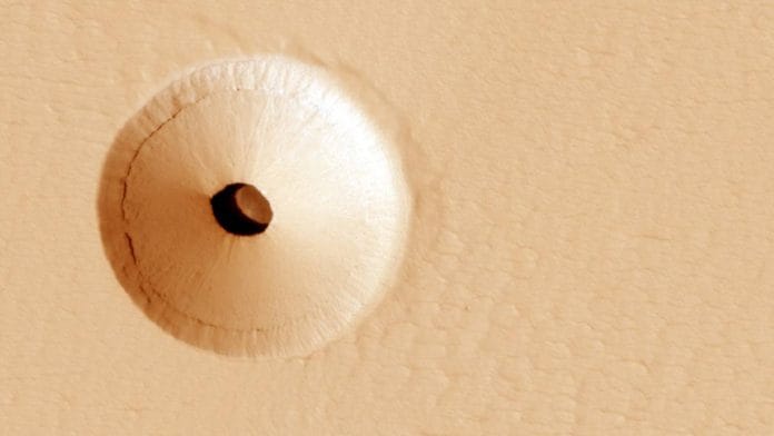 NASA discovered a mysterious hole on Mars that could hold clue to life on the red planet. The hole appears to be an opening to an underground cavern | Photo: ANI/NASA