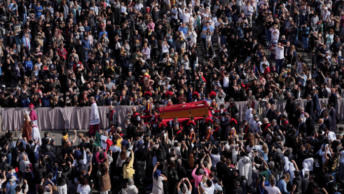 The ceremony with the Pope Francis' body, who will lie in state at St. Peter's Basilica for three days, pass through the crowd at the Vatican, Wednesday, 23 April 2025. | AP Photos via PTI