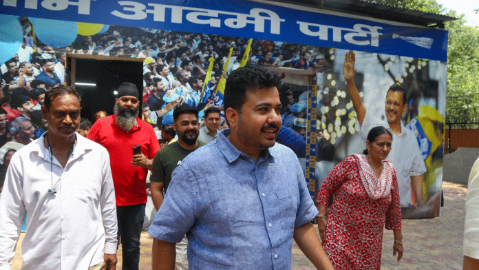 Durgesh Pathak, the AAP's Gujarat co-in-charge, leaves after a press conference following the CBI raid at his residence | Suraj Singh Bisht | ThePrint