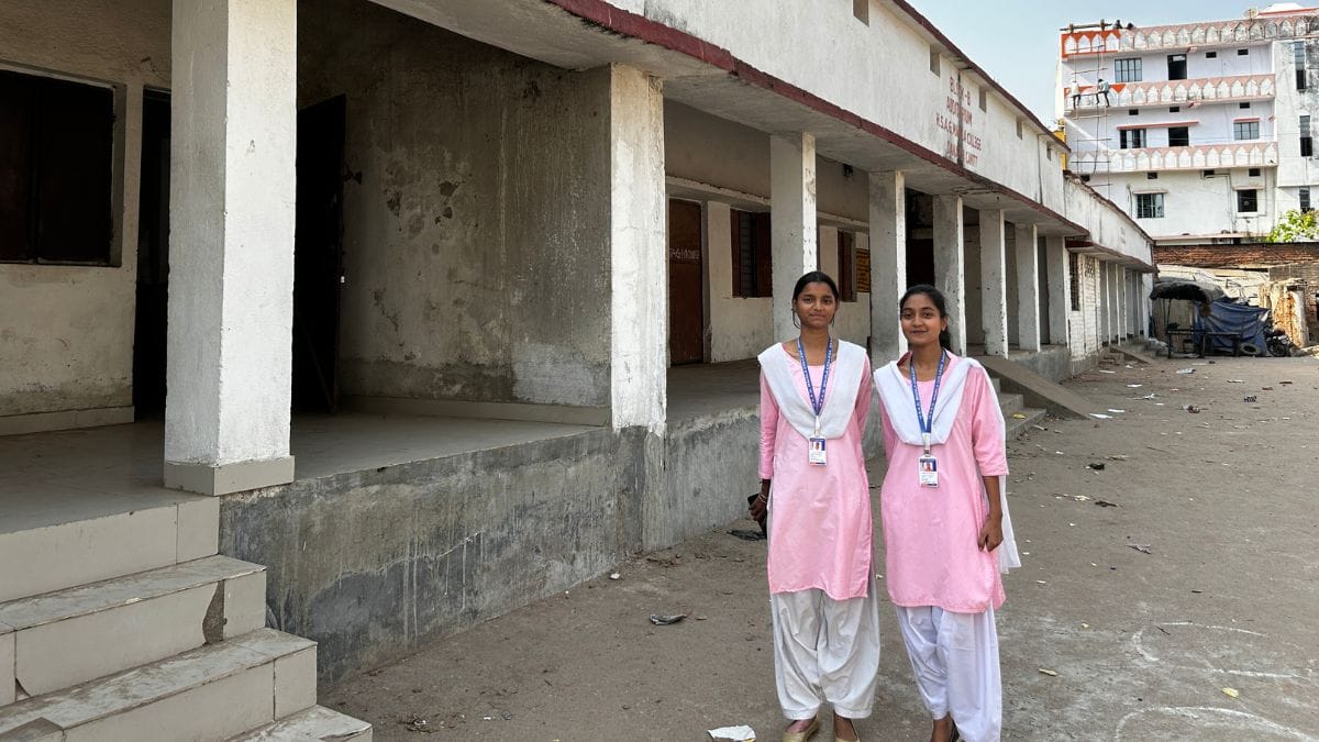 Two science students pose on the premises of their college