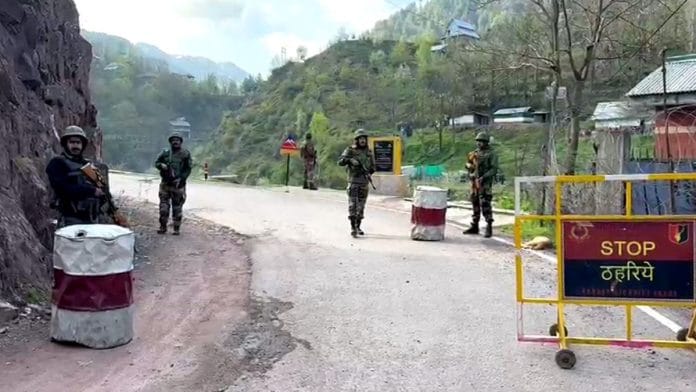 Indian Army and J&K Police personnel stand guard on a road in Uri. | Representative image | ANI