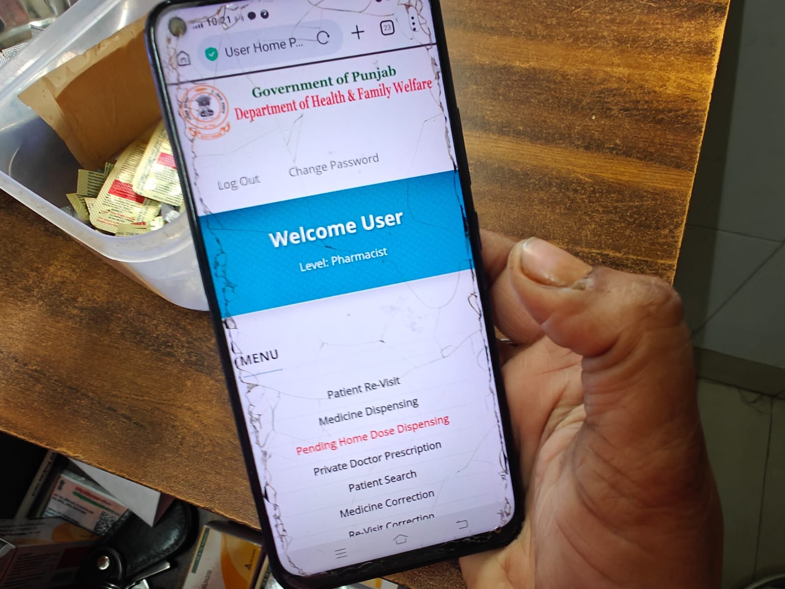 A staffer operates the PDDRC portal on their mobile phone | Mayank Kumar | ThePrint