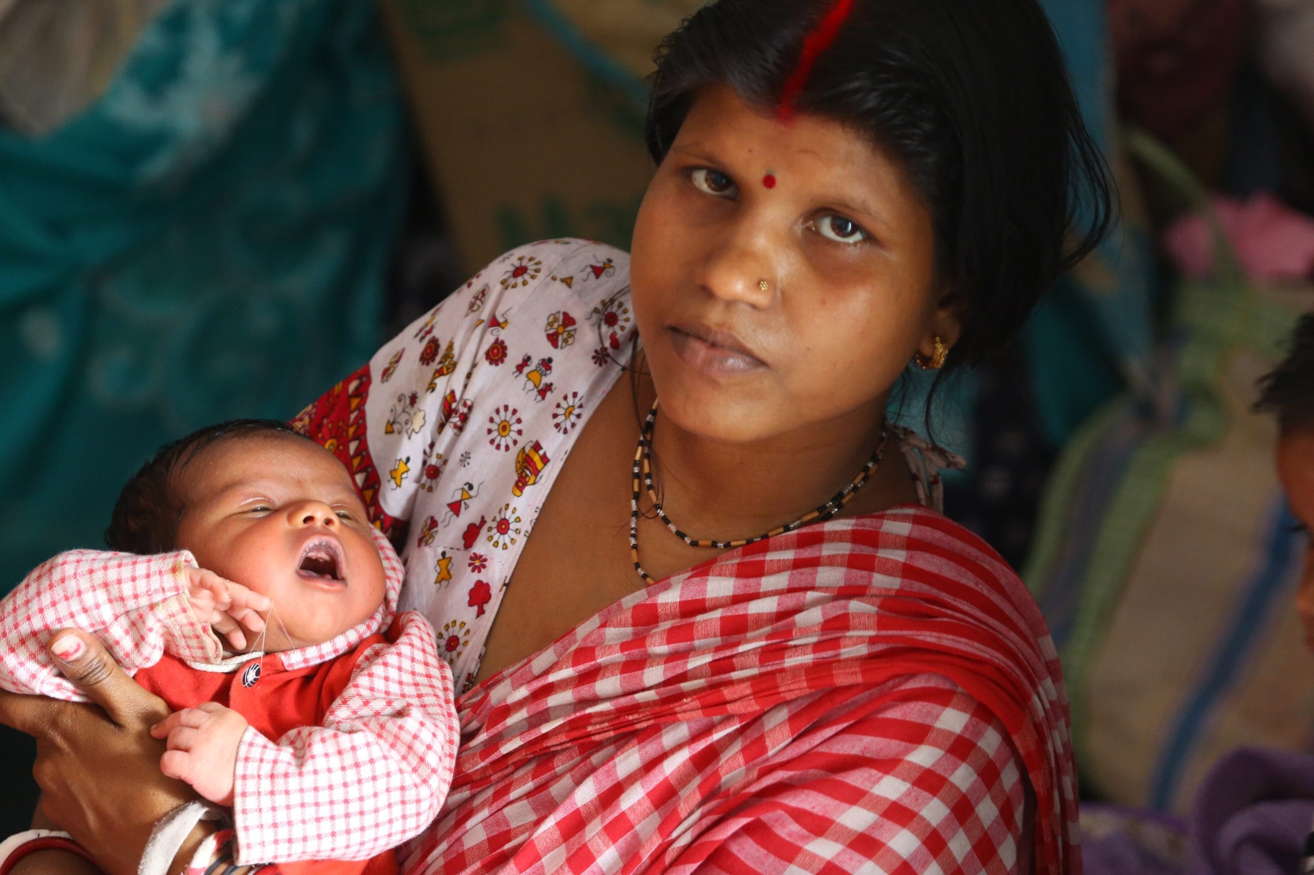 Saptami Mondol and her 10-day old child Hariom Mondol at the relief camp in Parlalpara High School in Malda | Praveen Jain | ThePrint