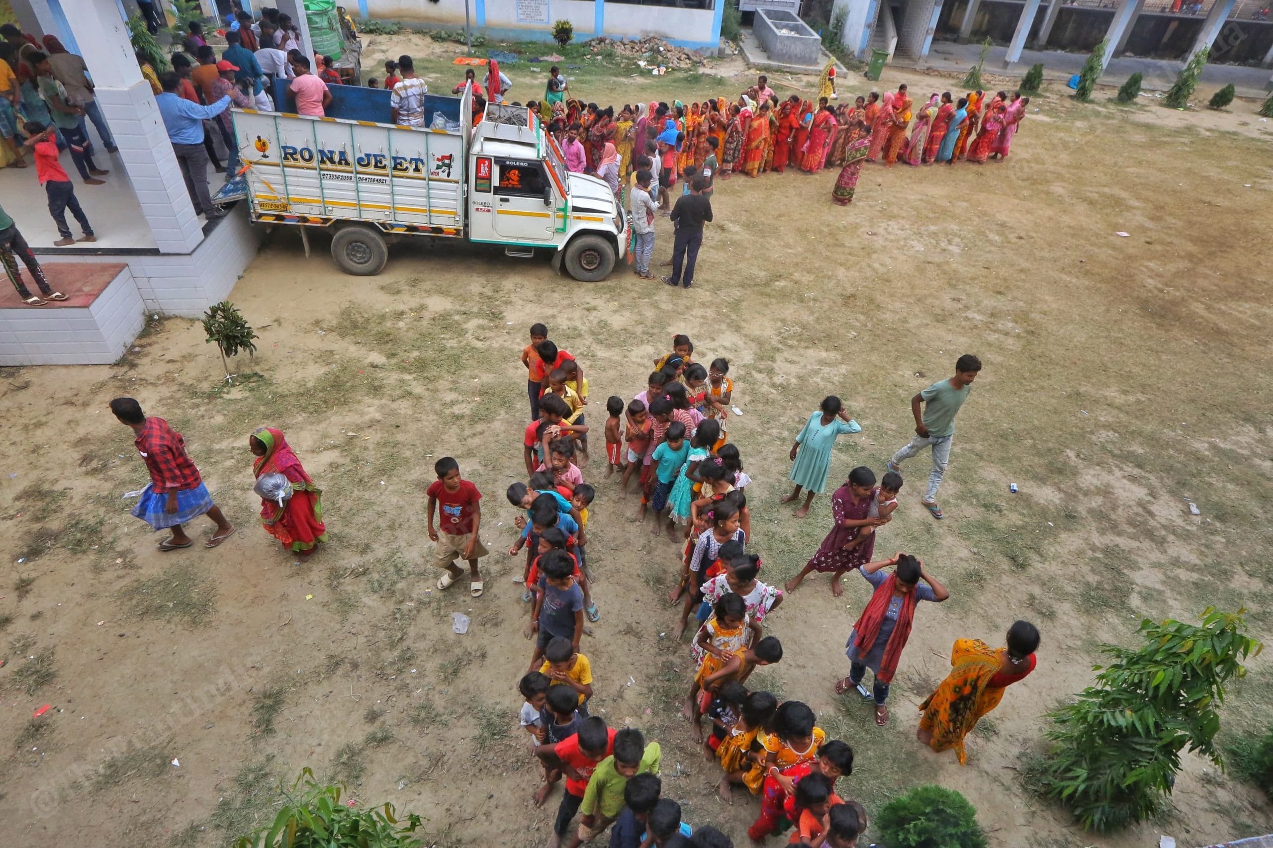 People in queue for food at the school acting as a relief camp | Praveen Jain | ThePrint
