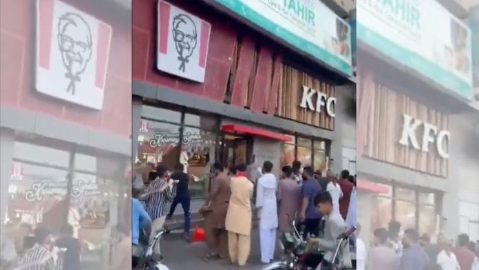 Mob attacking a KFC outlet in Karachi, Pakistan