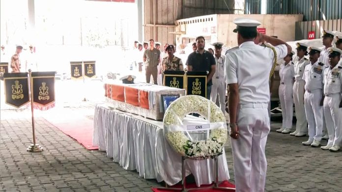 A Navy officer pays tribute to the mortal remains of Indian Navy Lieutenant Vinay Narwal | ANI