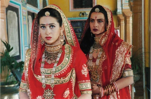 Karisma Kapoor and Rekha in a still from Zubeidaa. They are both married to a Maharaja Vijayendra Singh of Fatehpur (played by Manoj Bajpayee) in the film | Photo via X