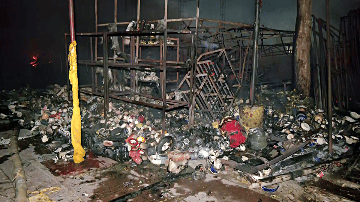 Charred remains a shop after a fire broke out at Dilli Haat, in New Delhi on Wednesday | ANI
