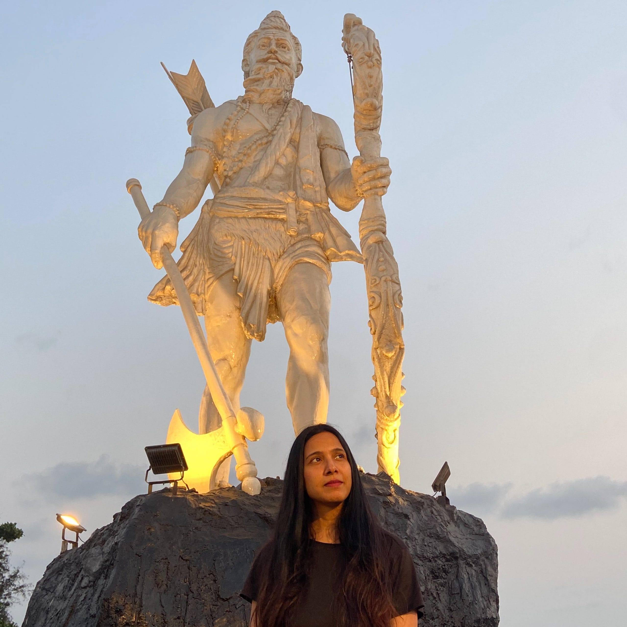 Tiwari posing with a statue of Parshuram