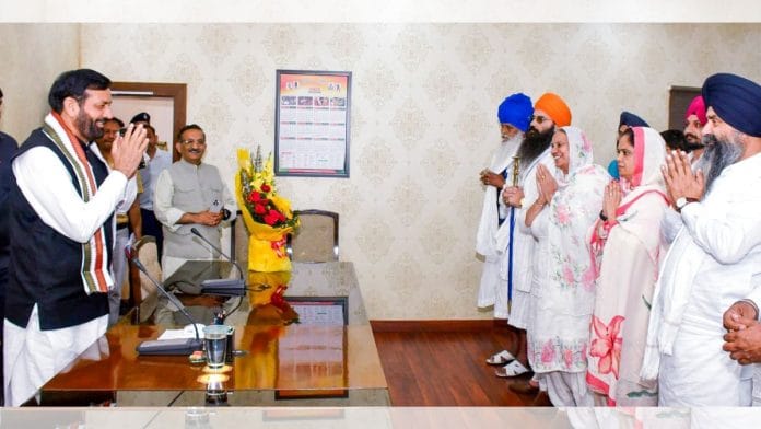 Haryana Chief Minister Nayab Saini exchanges greetings with newly elected members of the Haryana Sikh Gurdwara Management Committee, in Chandigarh, Sunday. | ANI