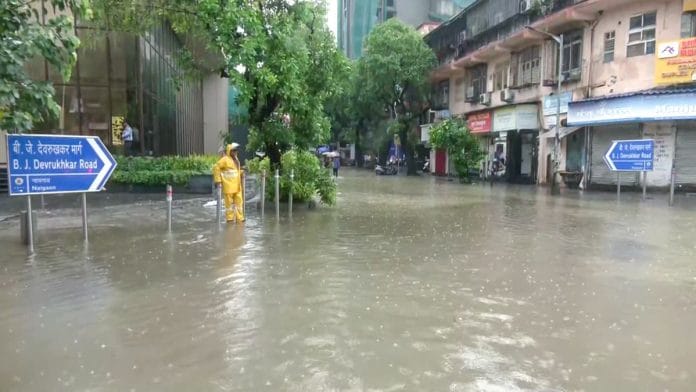 A severely waterlogged road following heavy rainfall, at Dadar Hindmata in Mumbai, Monday. | ANI