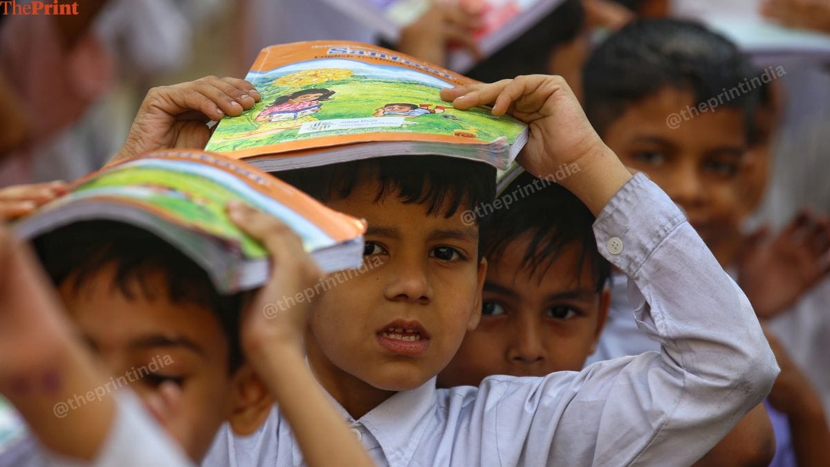 Students cover their head with books and notebooks during the mock drill. | Manisha Mondal | ThePrint