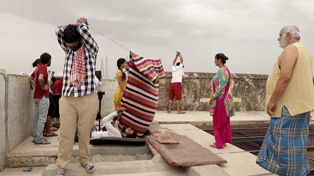 On the set of Pinjre Ki Titliyan, two crew members hold up a clothesline—there were no walls tall enough to tie it to. | By special arrangement 