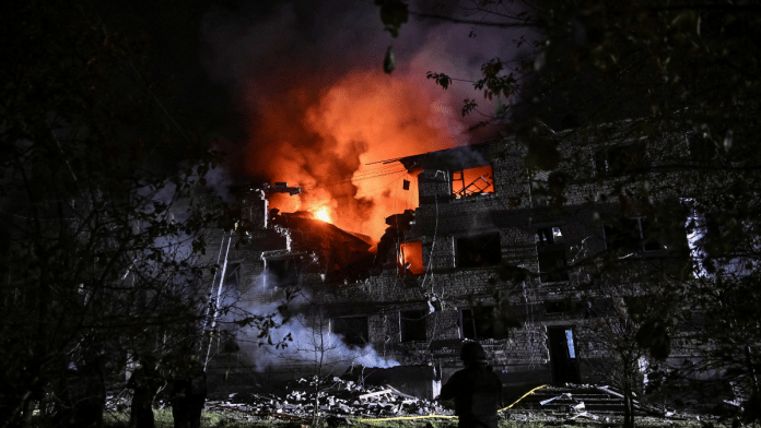 Rescuers work at a site of an apartment building hit by a Russian drone strike, amid Russia's attack on Ukraine, in Zaporizhzhia, Ukraine on 1 May 2025. | Stringer | Reuters