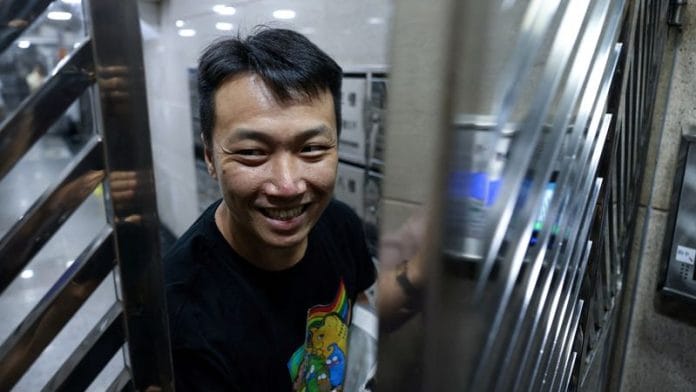 Pro-democracy and LGBT+ rights activist Jimmy Sham Tsz-kit arrives at his residence after serving a four-year and three-month sentence for conspiracy to commit subversion in a landmark national security case, in Hong Kong, China Friday | Reuters/Tyrone Siu