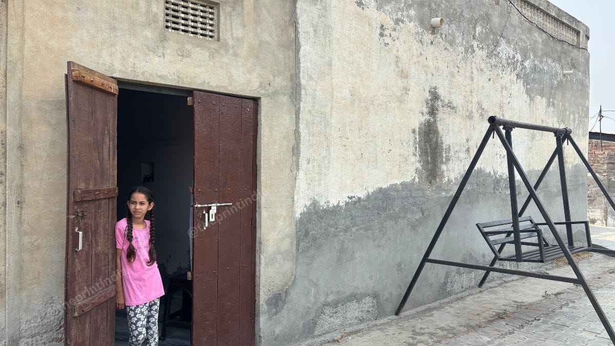 Angrez Singh's granddaughter, Gudiya. She tried to inspect the debris near her house but was stopped by her mother | Photo: Bismee Taskin, ThePrint