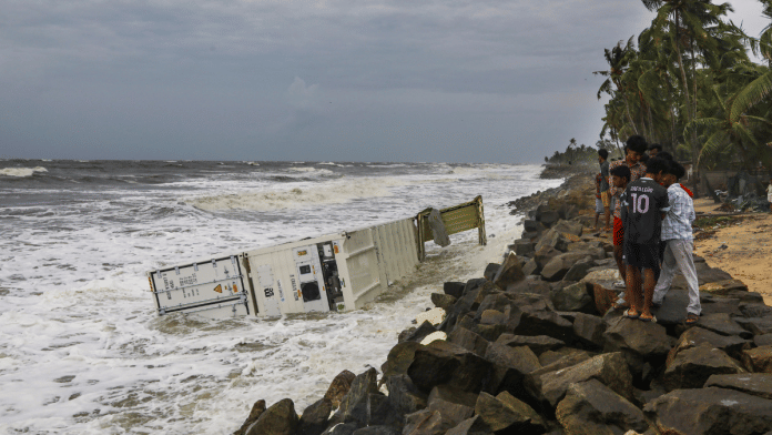 Containers from ship MSC Elsa 3 that sank at the Kochi outer harbour drift ashore, in Kollam on Monday | PTI