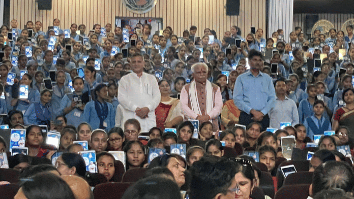 File photo showing senior BJP leader Manohar Lal Khattar (wearing white scarf) at an event in which tablets were distributed to students of government schools in 2022. Khattar, a Union minister, was back then the chief minister of Haryana | X