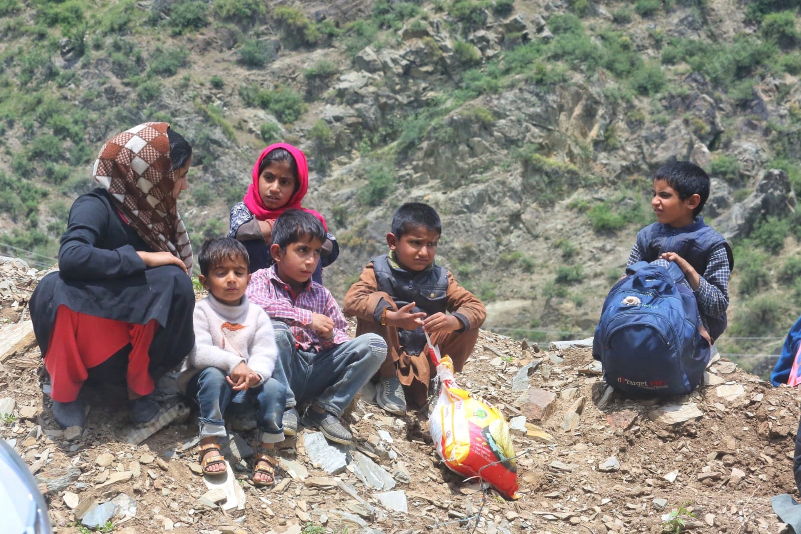 Children wait at entry of Uri town as administration sanitises damaged sites | Photo: Praveen Jain | ThePrint