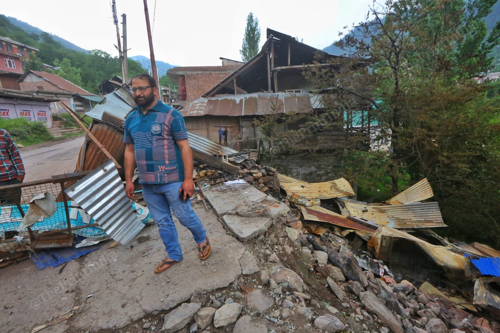 Sajjad Ahmed near the wreckage of his grocery shop, which was shelled on 8 May | Praveen Jain | ThePrint