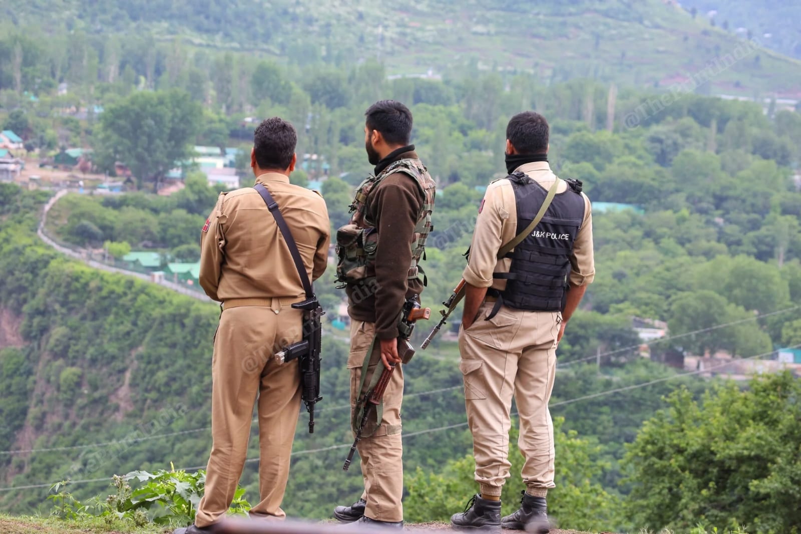 J&K Police personnel looking over river Jhelum in Baramulla | Photo: Praveen Jain | ThePrint