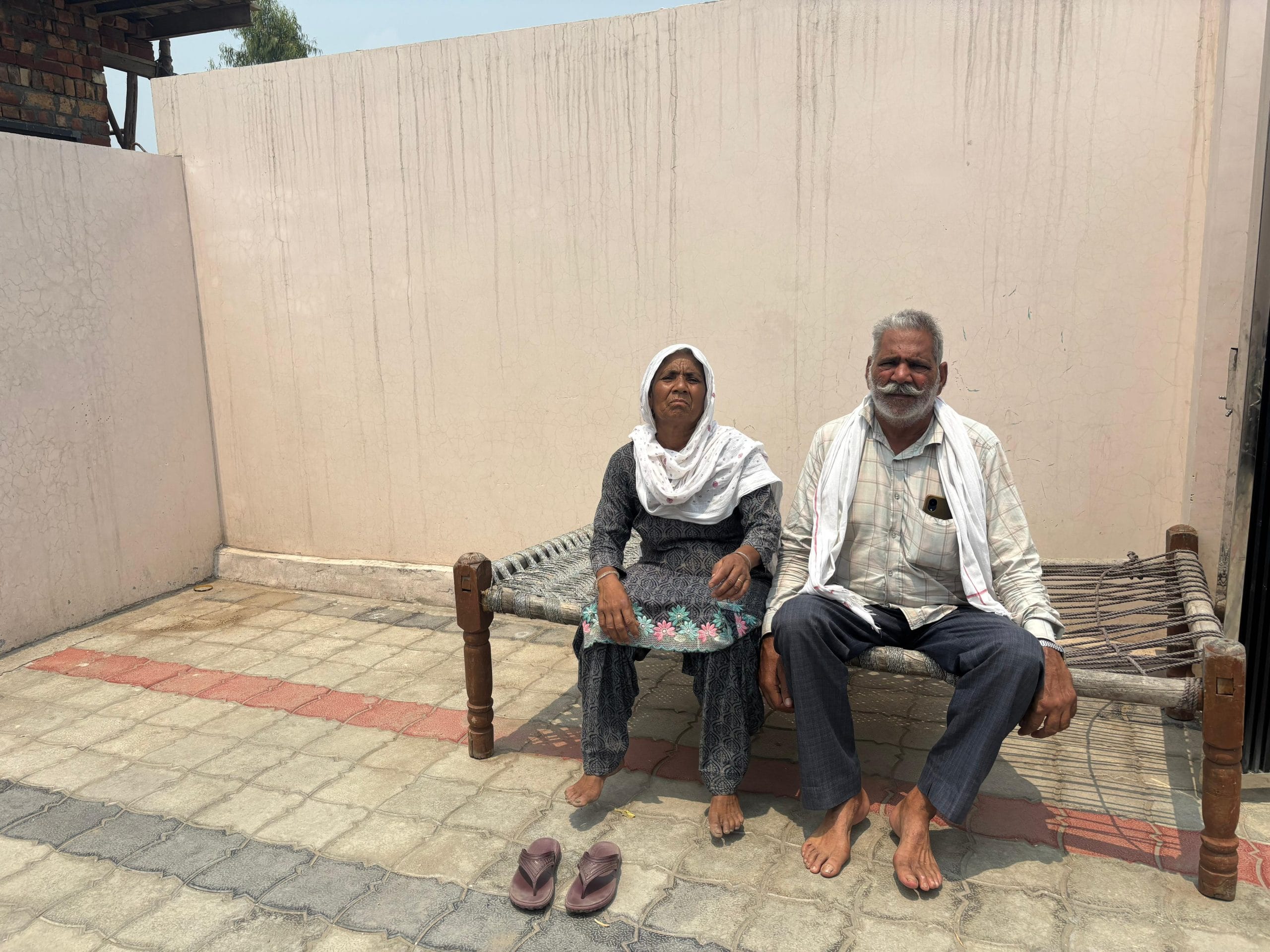 Puran Singh and his wife Banto Bai sitting on a charpai | Bismee Taskin | ThePrint