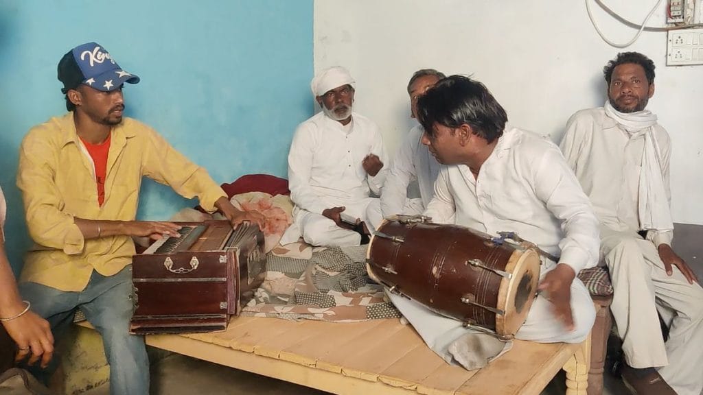 Actors rehearse their next scene on the set of Saangi, singing folk songs while playing the harmonium and dholak. | Sakshi Mehra | ThePrint