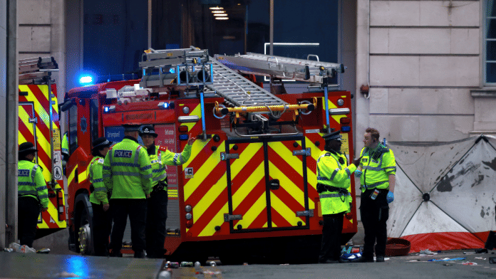 Emergency services at the scene after multiple people were hit by a car during the Victory parade, 26 May 2025 | Reuters