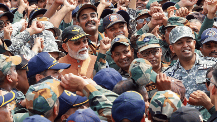 PM Modi with armed forces personnel during his visit to Adampur airbase Tuesday. | ANI