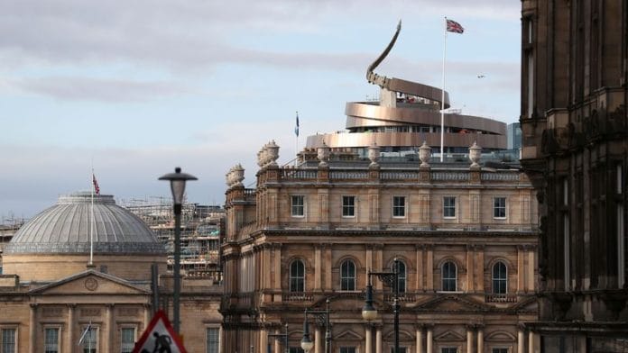 Union and Scotland flags fly over buildings in central Edinburgh, Scotland. | File Photo | Russell Cheyne | Reuters