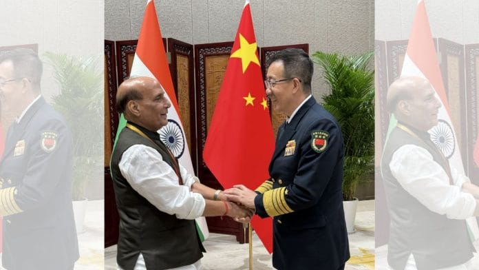 Defence Minister Rajnath Singh with Chinese Defence Minister Admiral Dong Jun on the sidelines of the SCO Defence Ministers' Meeting, in Qingdao | Photo: X, @rajnathsingh