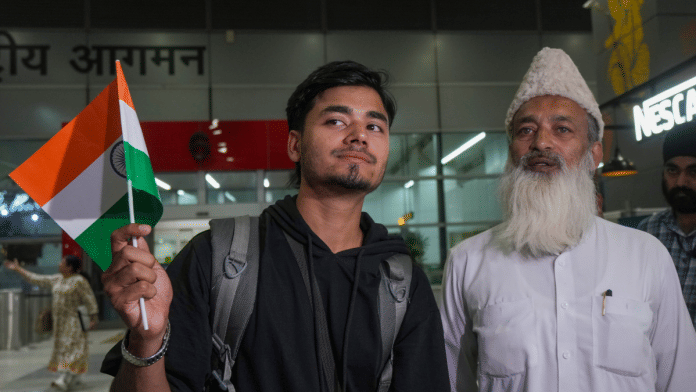An Indian student returning from Iran via Armenia, under an evacuation operation facilitated by the Government of India, reacts as he stands with a relative while exiting from the Indira Gandhi International Airport, in New Delhi, Thursday, June 19, 2025 | PTI