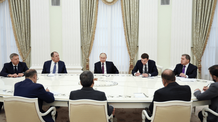 Russian President Vladimir Putin attends a meeting with Iranian Foreign Minister Abbas Araqchi, as Head of the Russian General Staff's Main Intelligence Directorate Igor Kostyukov, Russian Foreign Minister Sergei Lavrov and Presidential Aide Yury Ushakov sit nearby, at the Kremlin ion 23 June 2025. | Alexander Kazakov | Sputnik | Pool via Reuters