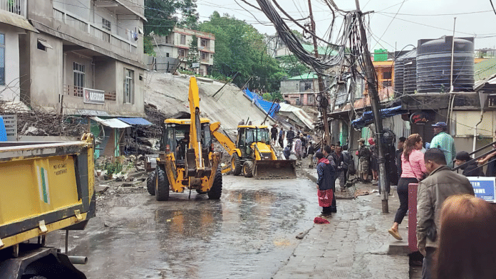 Rescue operations underway after a building collapses due to heavy rainfall, in Lawngtlai on Sunday | PTI