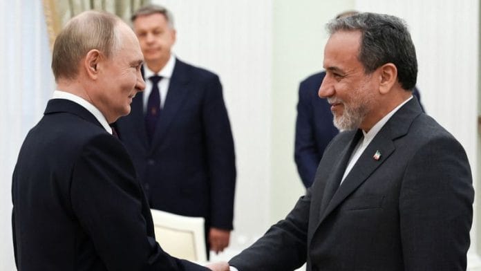 Russian President Vladimir Putin shakes hands with Iranian Foreign Minister Abbas Araqchi during a meeting at the Kremlin in Moscow, Russia on 23 June 2025. | Alexander Kazakov | Sputnik | Pool via Reuters
