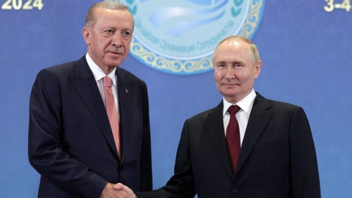 Russian President Vladimir Putin shakes hands with Turkish President Tayyip Erdogan duringthe Shanghai Cooperation Organization (SCO) summit in Kazakhstan on 3 July 2024. | File Photo | Gavriil Grigorov | Sputnik | Pool via Reuters