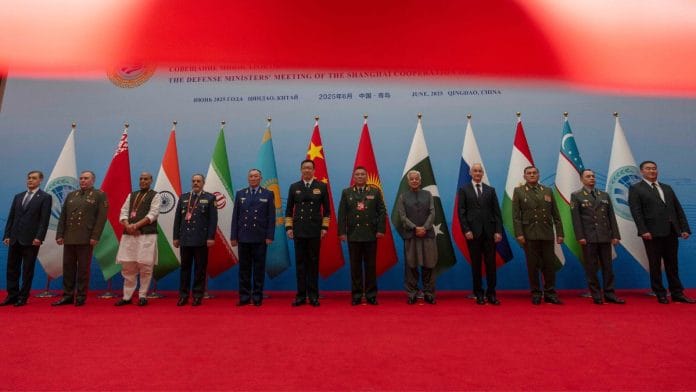 Indian Defence Minister Rajnath Singh with heads of defence at the Defense Ministers' Meeting of the Shanghai Cooperation Organization Members States in Qingdao in eastern China's Shandong province, 26 June, 2025. | AP/PTI