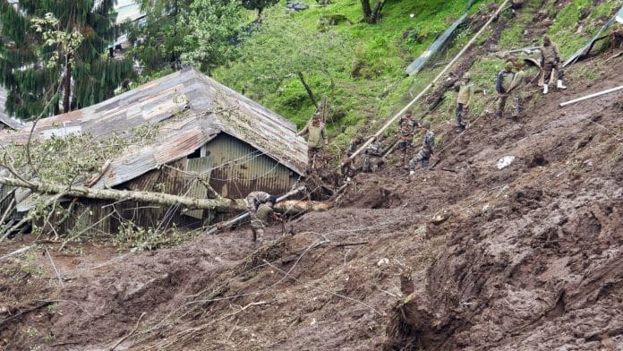 Rescue teams at work after a landslide, triggered by heavy rainfall struck the Indian Army military camp, at Chaten in Lachen Monday | ANI